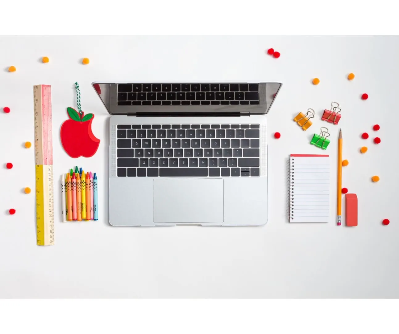 Laptop, ruler, crayons, pencils